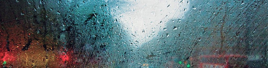 street-through-rainy-bus-window